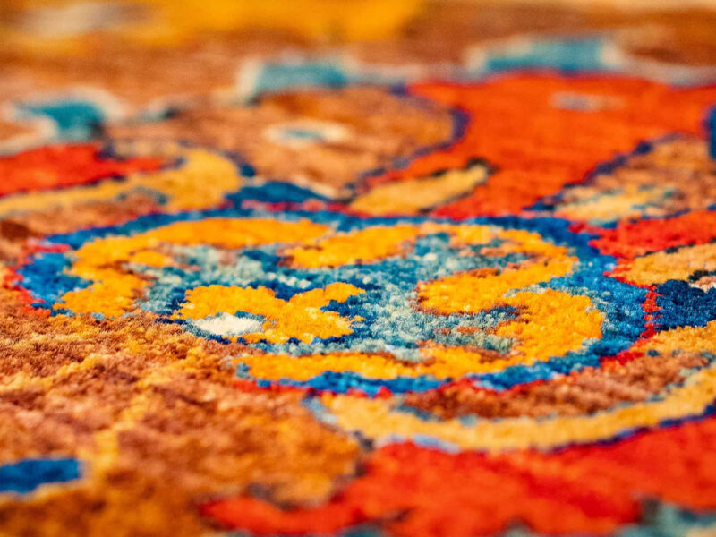 Bright red and yellow hand-knotted indian rug